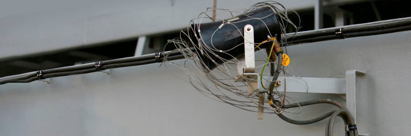 An overhead light fixture secured by a Dropsafe Net.