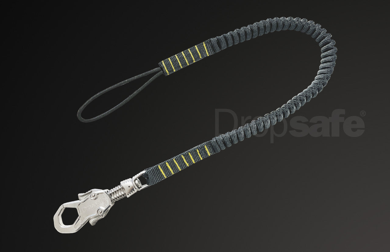 Green plastic handle with silver carabiner and black-yellow webbing loop lanyard