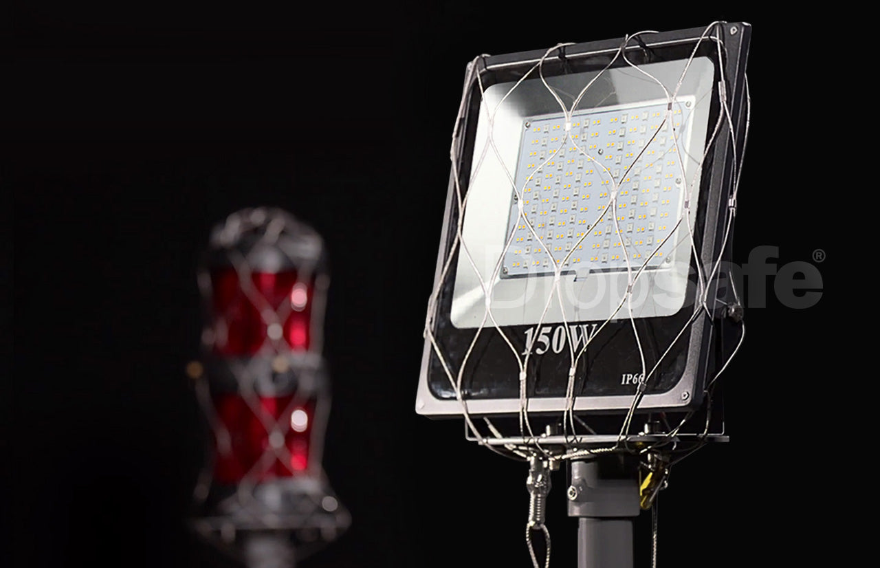 Sleek 150W LED floodlight with white panel and silver mesh cage by Dropsafe Nets