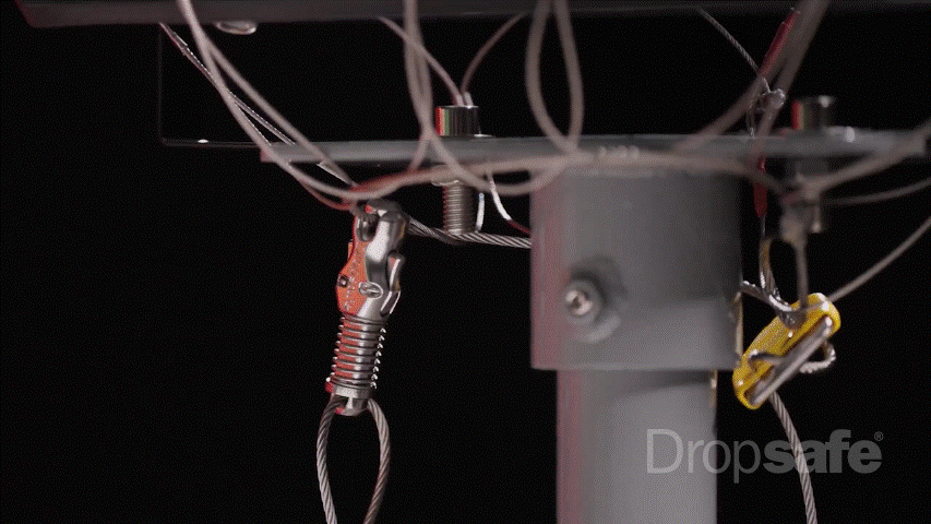Silver and yellow carabiner clips with spring-loaded mechanisms on steel cables in Dropsafe Nets