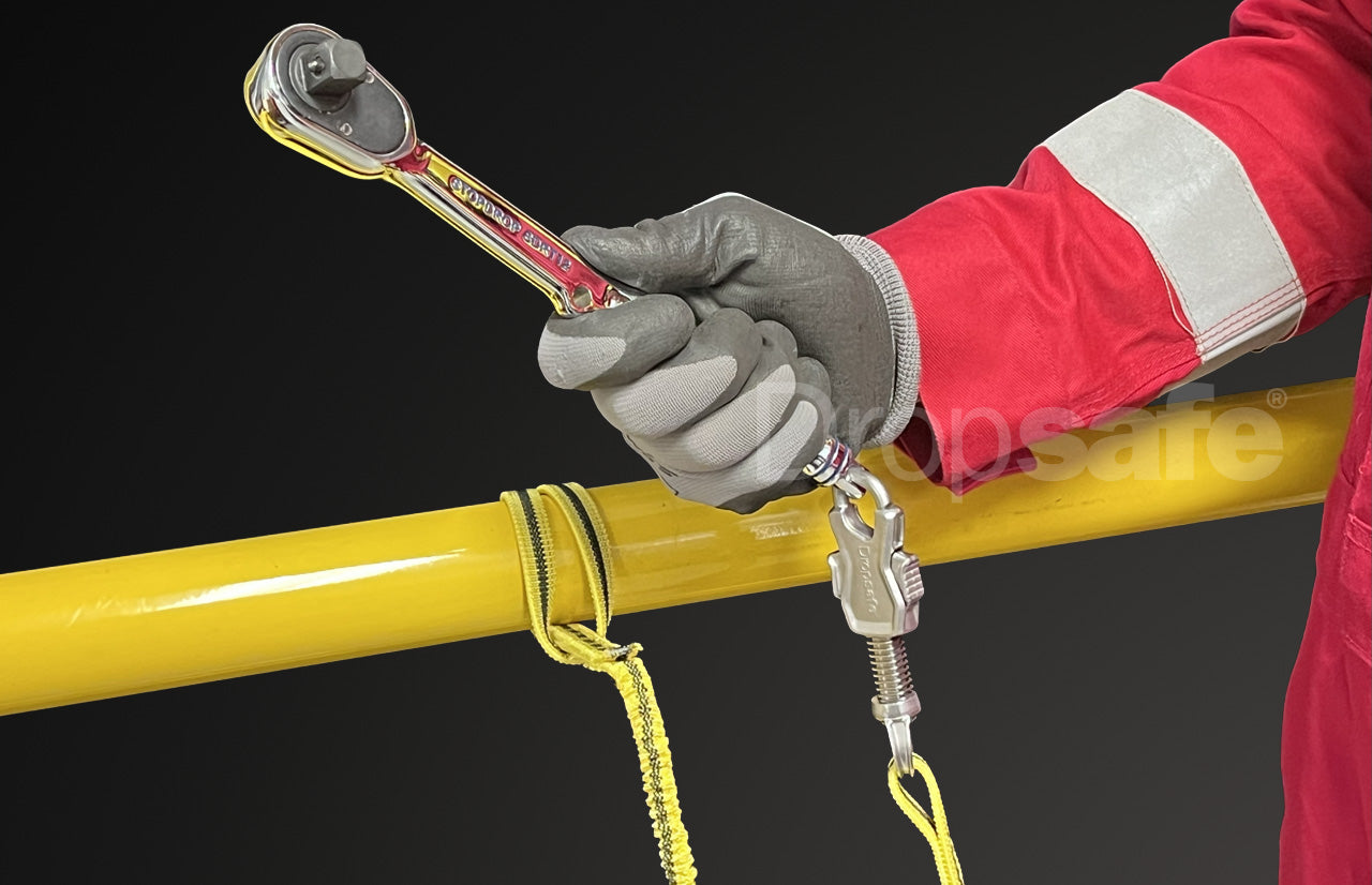 Red and silver torque wrench with yellow coiled lanyard in Dropsafe Tool Tethering