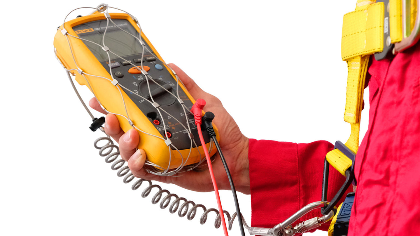 Yellow Fluke multimeter in protective pouch with mesh cover and coiled leads