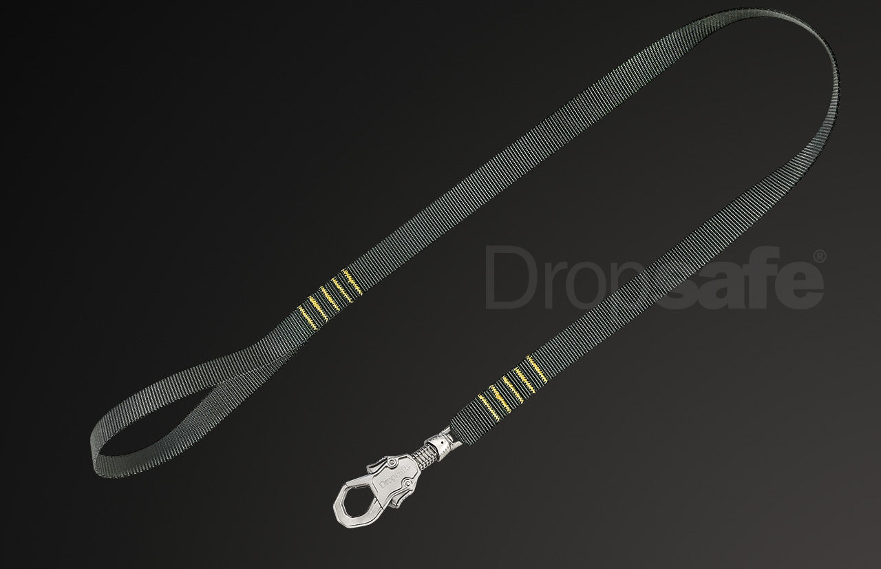 Green plastic handle with silver carabiner and black-yellow webbing loop lanyard