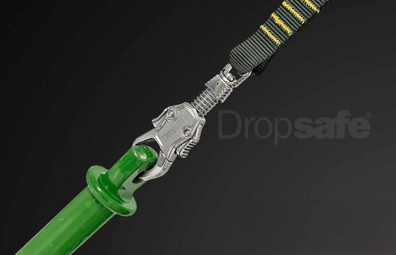 Green plastic handle with silver carabiner and black-yellow webbing loop lanyard