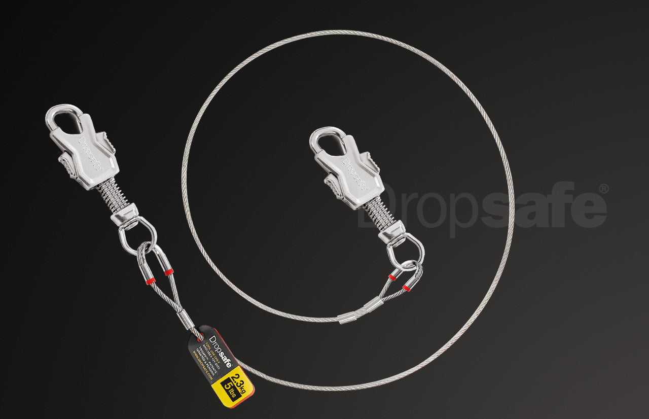 Silver stainless steel dropsafe lanyard with 28kg capacity, coiled, twin carabiners, 2.3kg max